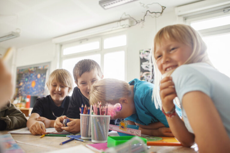 happy students sitting at desk in classroom 2023 11 27 05 25 40 utc 1024x683 1 768x512
