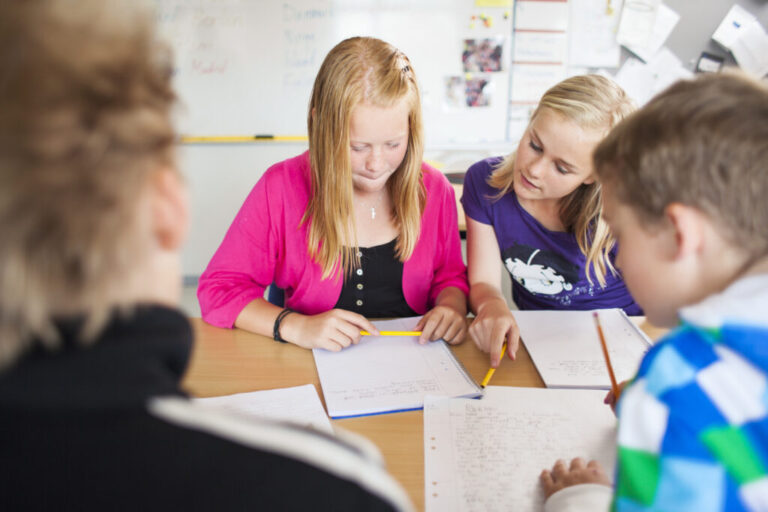 junior high students studying together at desk in 2023 11 27 05 22 40 utc 1024x683 1 768x512