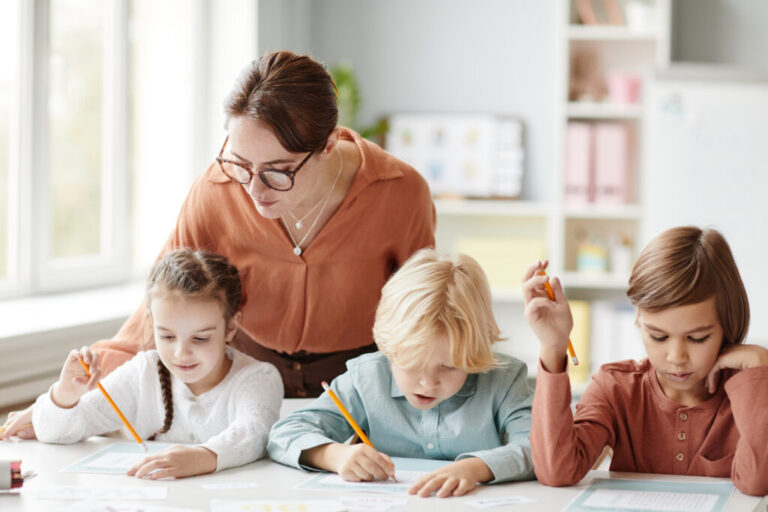 teacher teaching children at school 2023 11 27 05 21 20 utc 1024x683 1 768x512