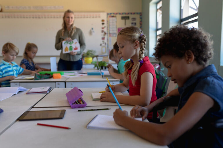 schoolgirls sitting at desks in an elementary scho 2023 11 27 05 25 11 utc 1024x683 1 768x512